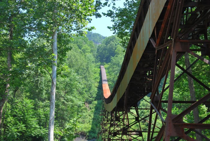 The Conveyor Trail in Nuttallburg takes hikers under the old coal conveyor of the Nuttall mine. Historical artifacts should be left in place and not disturbed along this trail.