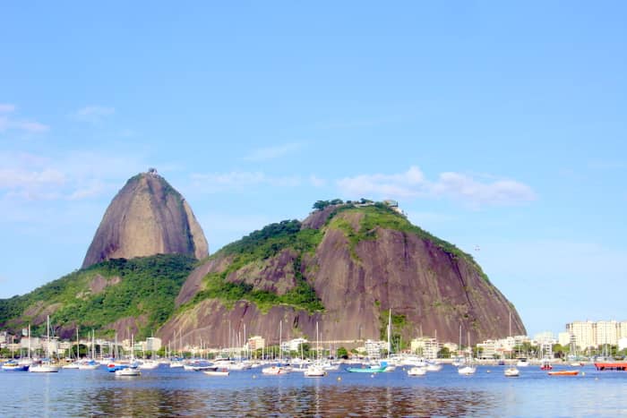 Pão de Açúcar (Sugarloaf Mountain) and Morro da Urca (the Hill of the Cargo Ship), overlooking private pleasure boats harbored in Botafogo Cove of Guanabara Bay.
