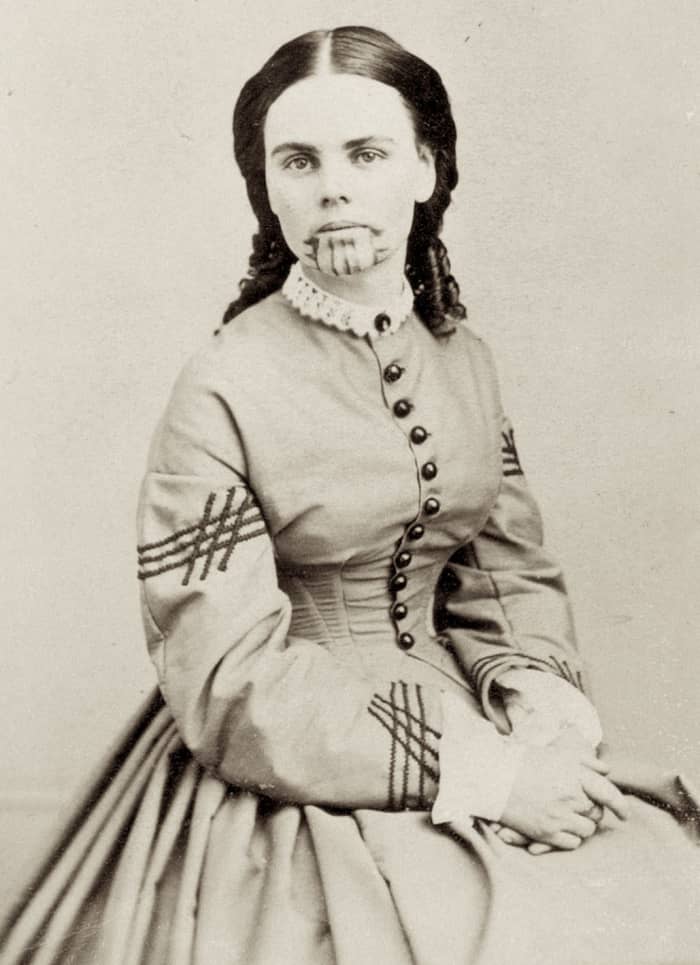 WikiPedia Photo of Olive Oatman from about 1863 about 7 years after her release from captivity. Note the blue tattoo on her chin—a symbol of her being a member of the Mojave tribe.