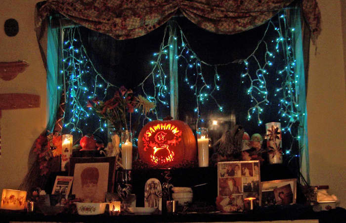 We host a big open house on Samhain, for the living and the dead. We set up a ritual altar for the actual ritual in a different room. But in the dining area we create this shrine to the ancestors for the season to honor them.