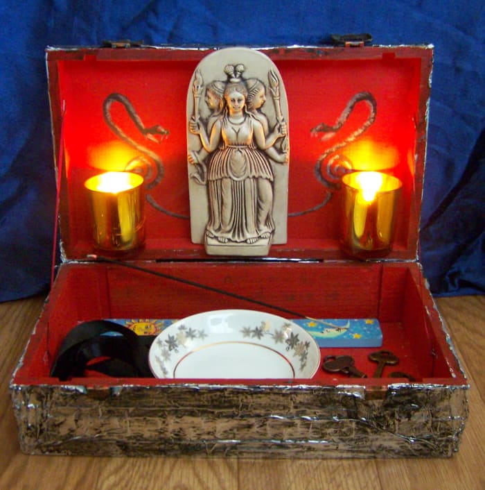 This shrine built into a box is convenient as I can pack it up when necessary and take it with me. If you live with people and don't feel comfortable keeping your shrine out in the open, this is a great solution.
