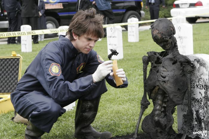 Dr. Brennan's assistant, Zack Addy, examines the remains in the season one episode "The Soldier On The Grave".