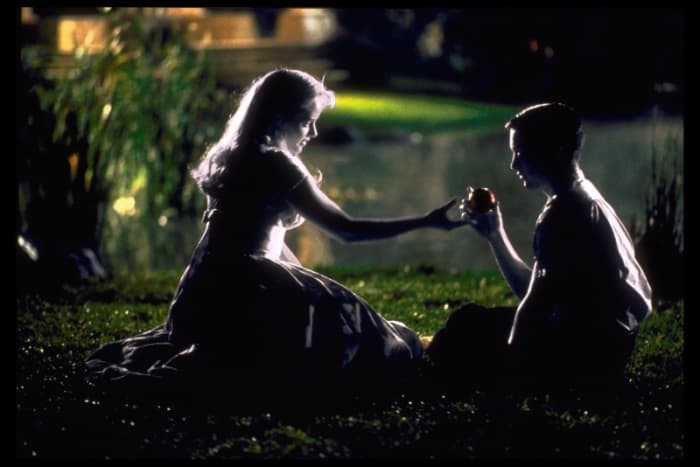She took the apple directly from the tree and gave it to him. It's partially a comedy, so it definitely doesn't worry about being heavy handed with its symbolism.