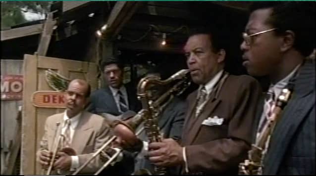 The sound of an anointed song coming from a nearby church causes the band at Harpo's juke joint to stop playing.