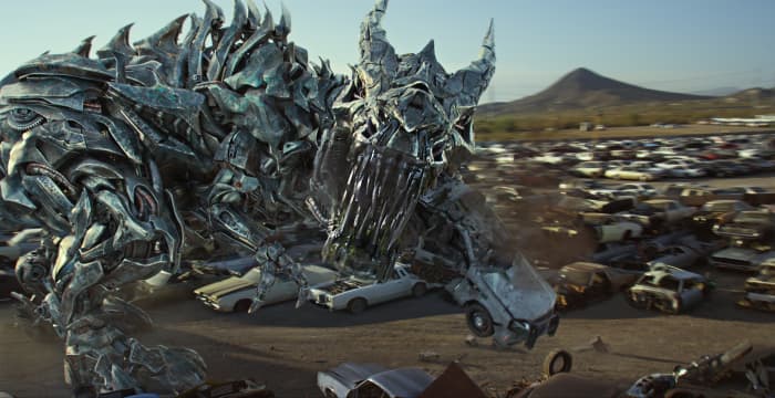 One of the most pointless cameos in "Transformers: The Last Knight" next to John Turturro is Grimlock since all he does is eat a police car and a Decepticon no one cares about.