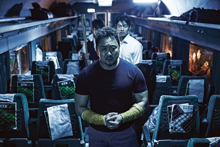 The tough-guy Sang-hwa - the working class man and anti-hero was my favourite character in this film. He wears a button up jacket nearly the whole way through.