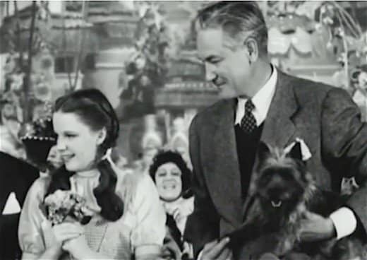 Dorothy Garland, Victor Fleming, and Toto. The llittle dog had millions of worldwide fans after accompanying Dorothy on her journey to the Emerald Kingdom in The Wizard of Oz.