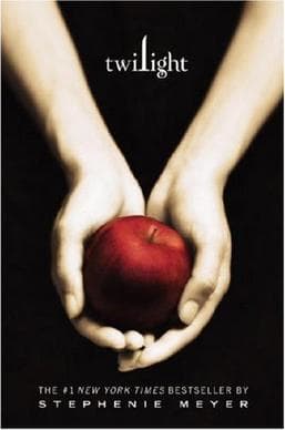 The Twilight book cover is an image of pale hands holding up an apple. Coincidentally Edward catches Bella's apple in the movie.