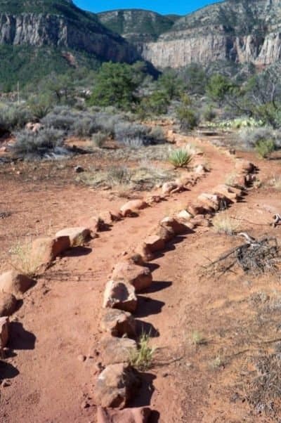 Rocks line the path on part of the Esplanade, to keep hikers on the trail and off the fragile crypto-biotic soil.