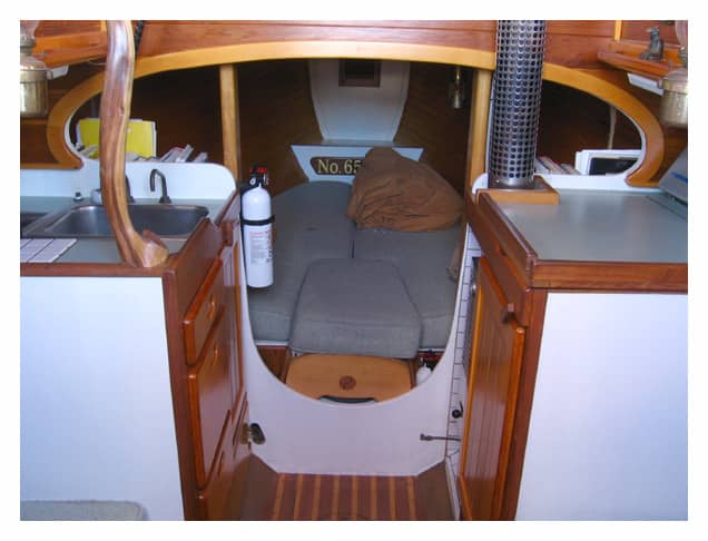 The cramped quarters down below do contain quiet a few amenities, including galley, v-berth, and a head (next to a cut-away v-berth in most models)