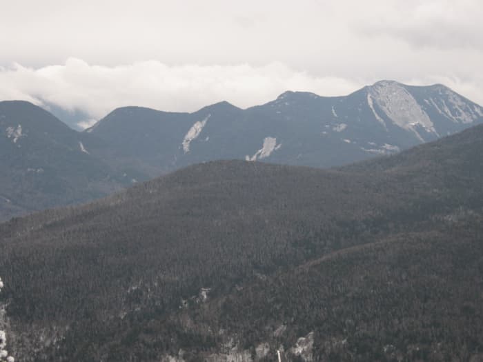 Snow clouds form over the Upper Range as seen from a lookout near the summit of Porter.