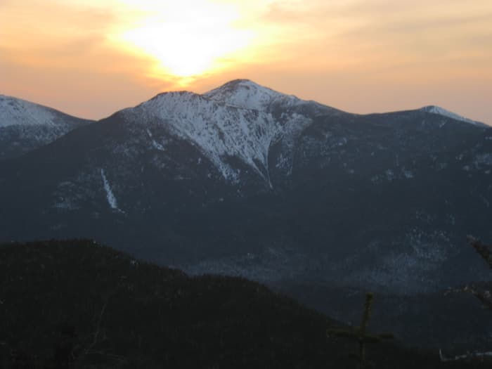 Walking at sunset is a great way to start a night hike. This picture, the setting sun over the Adirondack Great Range.