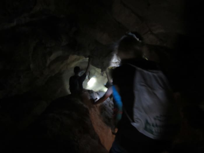 Making our way through one of the narrower passages inside Peppersauce Cave.