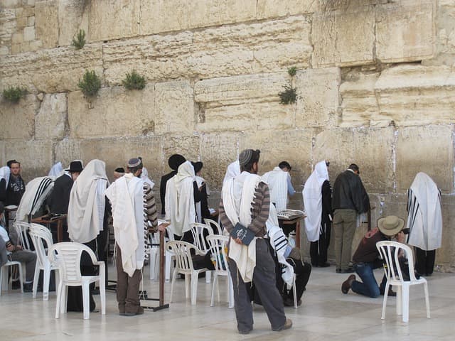 The Wailing Wall in Jerusalem, a sacred place for religious Jewish people. The wall is thought to be the last remaining part of the Jewish Temple, which was destroyed 2000 years ago by the Romans.