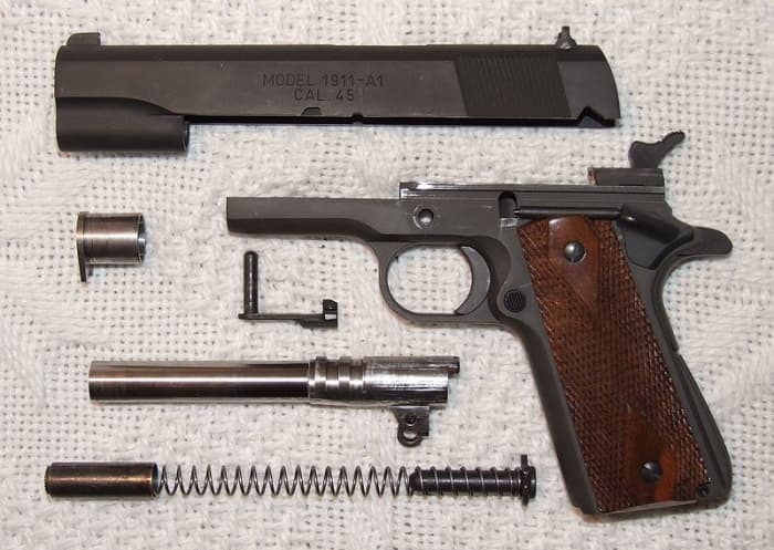 1911 Field Stripped. Note Barrel Lugs And Swinging Link. Link Cross Pin/Slide Release Is Above Barrel.
