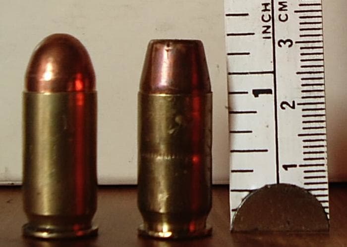 .45 ACP Cartridges: Military FMJ (L), Hollow Point (R). The Hollow Point's Blunt Nose Can Jam in a Stock 1911's Barrel Throat.