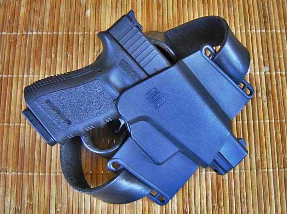 Glock In Holster.  Note Holster Covers Trigger Guard.