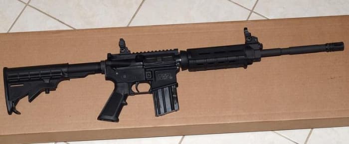 This AR has a flat top receiver and gas block. The front and rear sights are easily removed to allow optical sight installation.