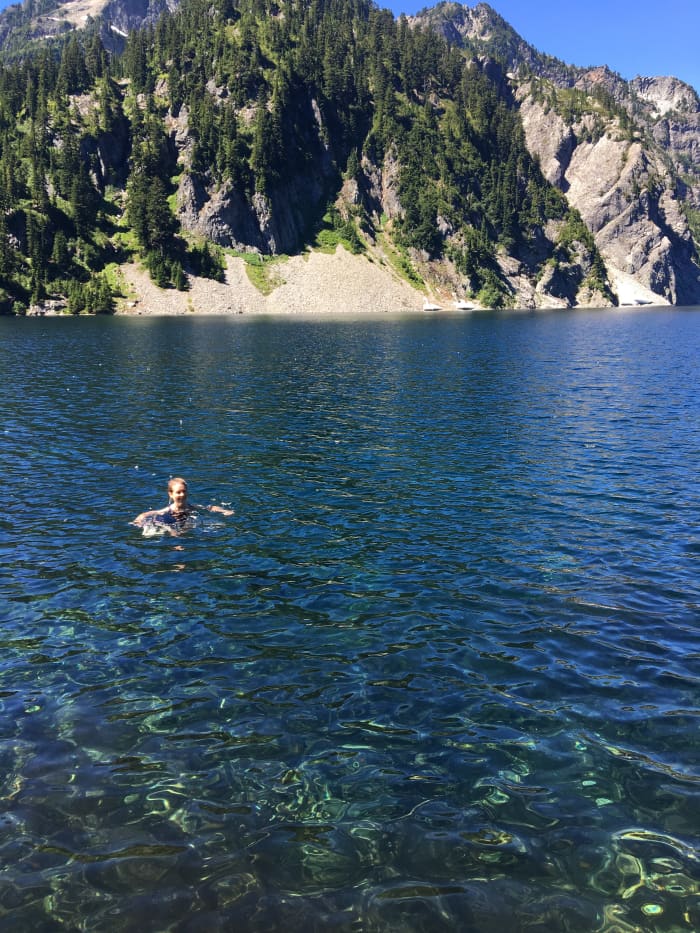 The water is so beautiful it's hard not to give into the temptation to swim, even if there's snow on the opposite shore.