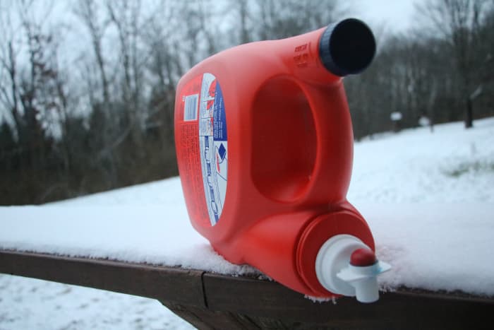 An emptied detergent container with a spigot creates an excellent wash station when camping.