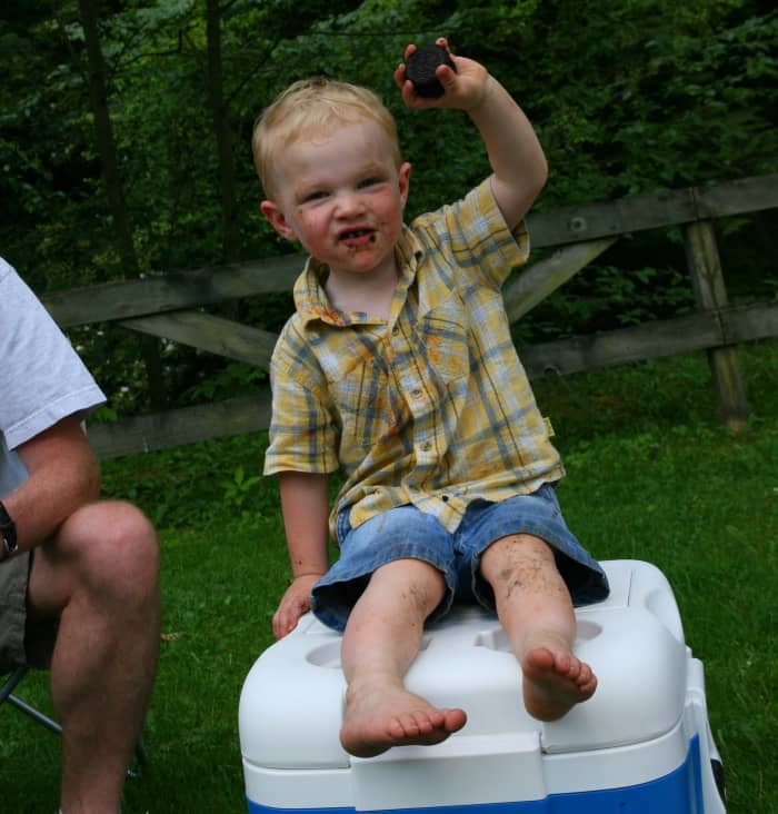 Camping toddlers are quite possibly the dirtiest humans on the planet. Keep plenty of wet wipes on hand and create a wash station out of an old laundry detergent container to help wash away the mess!