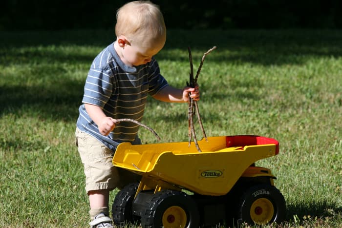 Toy cars and trucks are excellent toys at the campsite. Toddlers love filling the trucks with sticks, rocks, and other items they find in nature.