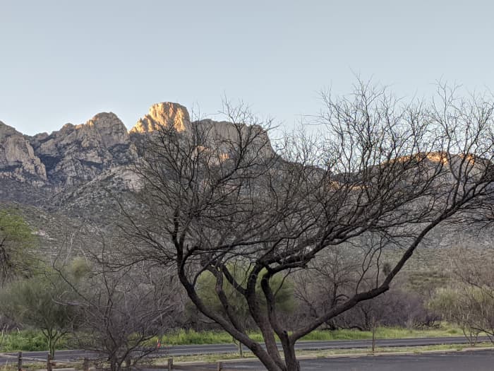 Rays from early morning Sun touching the tips of Mountain Peaks in Catalina State Park in Tucson, AZ