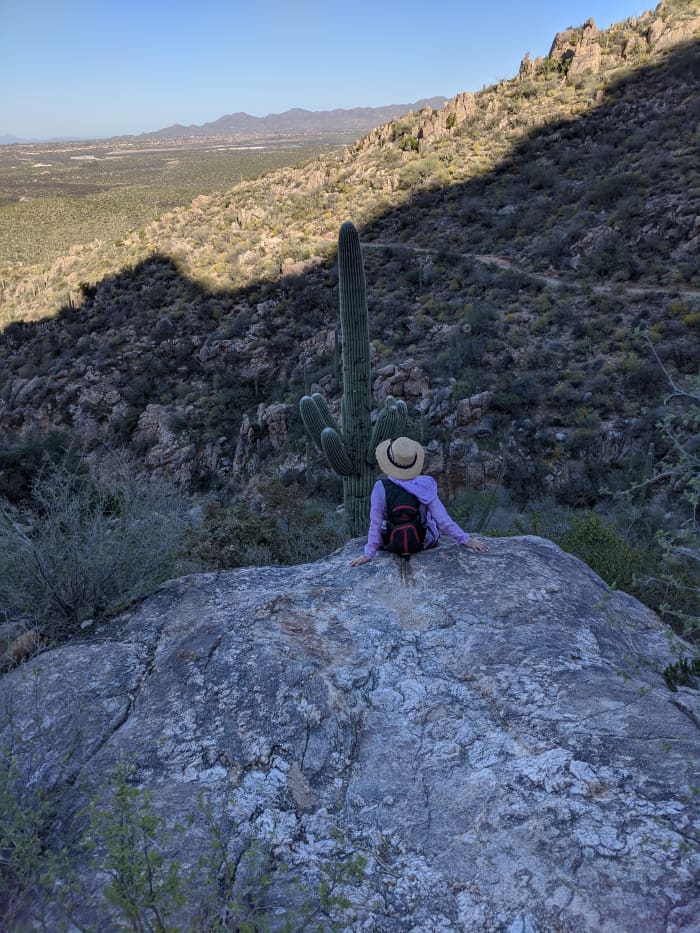 My wife maintaining social distancing while hiking to Romero Pools in Tucson Arizona's Catalina State Park