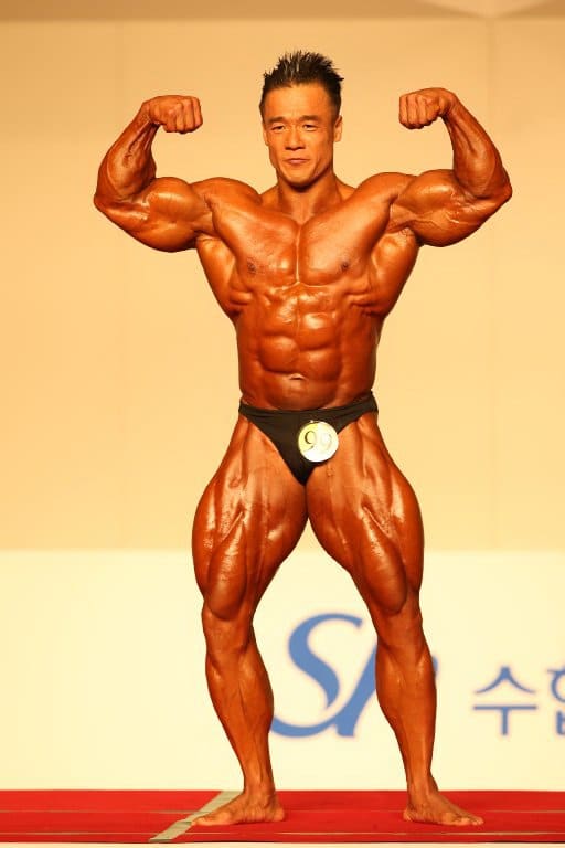 Korean bodybuilder Park Ki Seok (박기석) doing a double biceps pose at the 2012 National Sports Festival