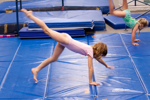Gymnastics is a great sport for kids to be involved in, but they should never do backbends before age 7.