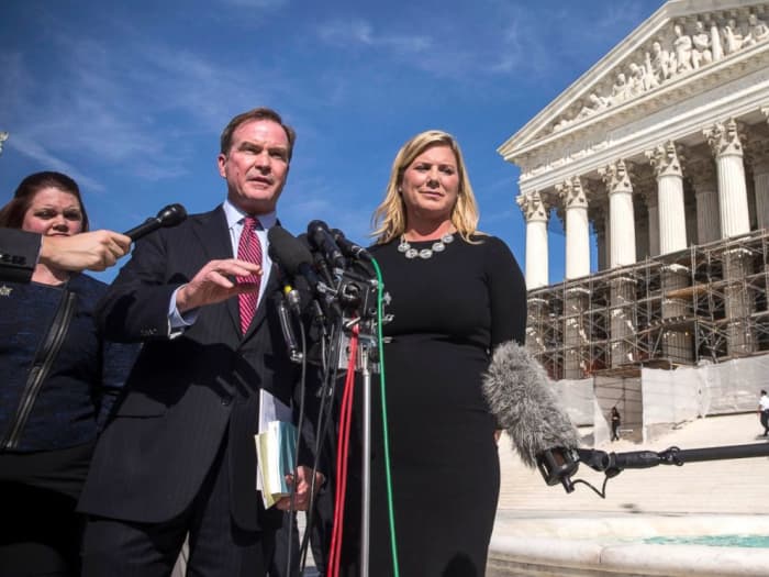 Michigan Attorney General Bill Schuette and Jennifer Gratz, CEO of XIV Foundationspeak, speak during a press conference outside the Supreme Court, Oct. 15, 2013, in Washington. Andrew Burton/Getty Images.