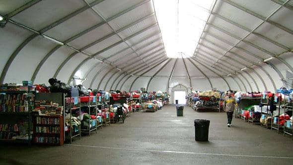 This image from a fabric shelter website shows a slight variation on current bed layouts for homeless shelters. Typically the beds would span the floor, no privacy or security while you sleep, which creates a danger to those sleeping there.