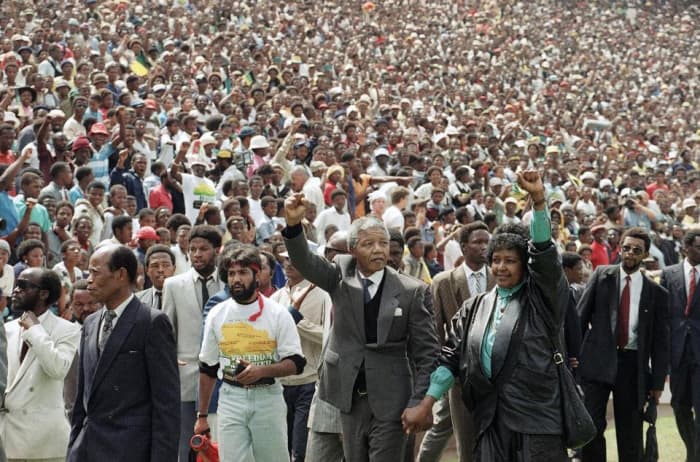 In the Great and Good Times Just After His Release, Winnie and Mandela hand-in=in=hand and waving "power fists to the Crowds