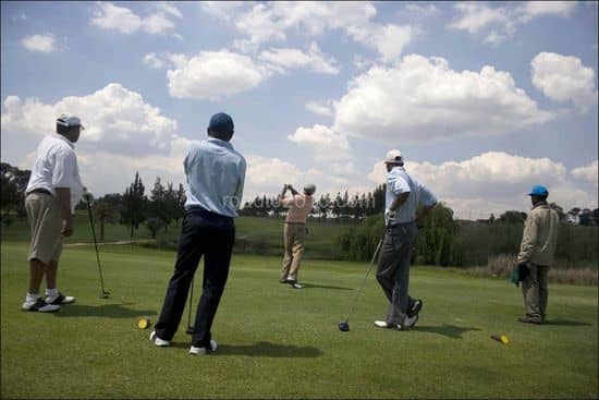 Black elites takes a swing during a game of golf with his friends at the Louewkop Golf Course in Sunninghill, Johannesburg, South Africa.