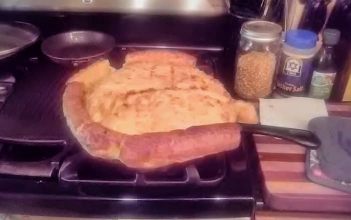 I was surprised how puffy the sorghum flour made this pancake, baked in a cast iron skillet. I snapped the photo in a rush borne of shock, just after removing the pan from the oven. The pancake "fell" quickly.