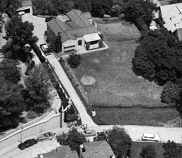 TV news helicopter shot of the LaBianca residence. Leno's Thunderbird and boat can be seen on the left.