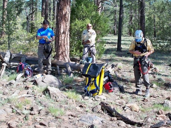 Here, a few of my teammates are getting their gear ready, adjusting their seat and chest harnesses, gloves and helmets....