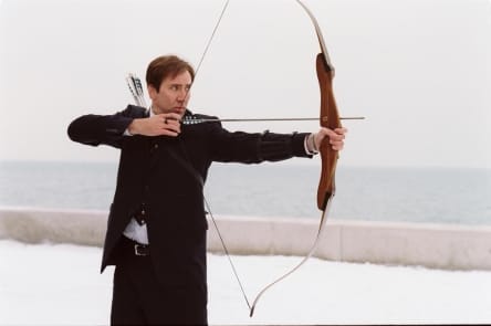 Nicholas Cage from the movie The Weather Man practicing archery to gain self-confidence and achieve wellness in his life.