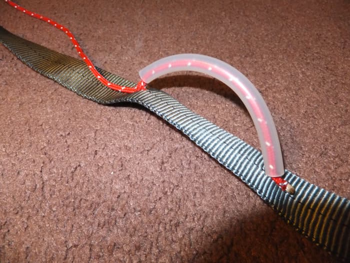 Bend your surgical tubing to an angle which will work for accessing your gear rack.