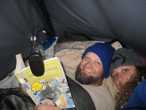 Camping outside Yosemite. This is how we spent some of our evenings after putting the campfire out. Snug as two bugs, but with a book!