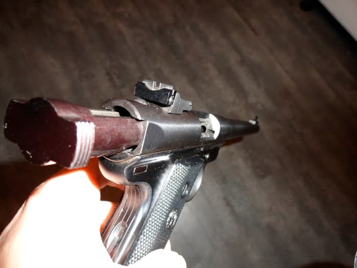 At the end of a magazine, the slide of the MK II locks back so you know you're empty, though felt recoil is so little that sometimes you pull the trigger once or twice on empty when firing rapidly.
