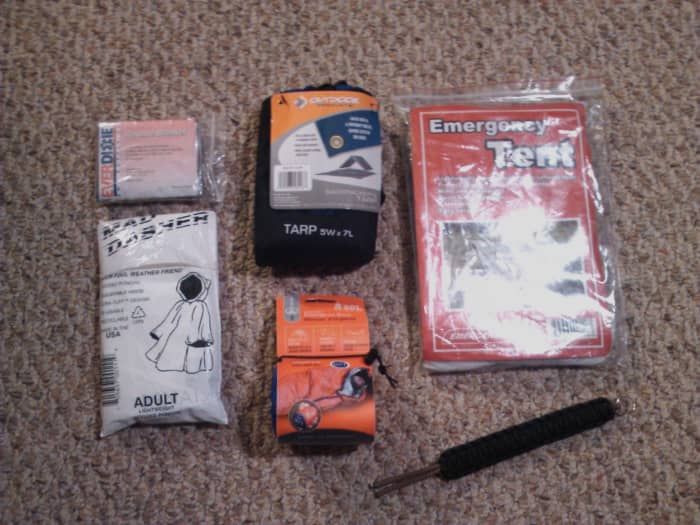 From left to right: rescue blanket, emergency tarp, emergency tent, poncho, emergency bivvy, and parachute cord.