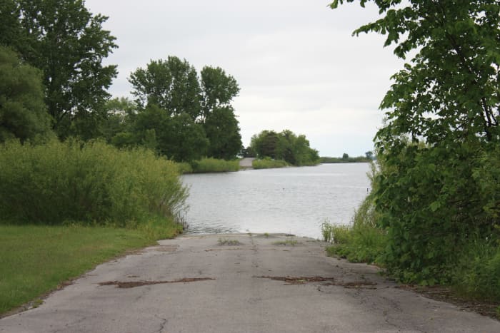 Standing at the edge of the old Highway 2.. Which is now almost completely under water, save for a few spots within the parkway where you can still see it vanish into the St. Lawrence.