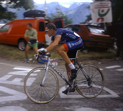Lance Armstrong riding to victory at L'Alpe d'Huez, during stage 10 of the 2001 Tour de France in his US Postal team kit