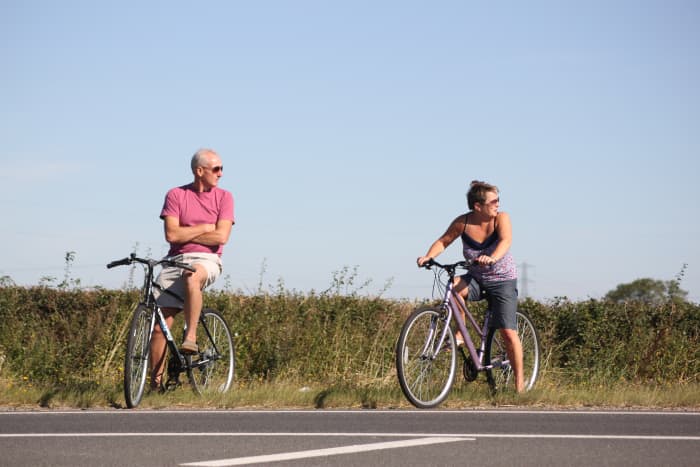Summer is a great time to ride your bike and you shouldn't worry a gentle ride will build huge thighs. It will have a far better effect on your health.