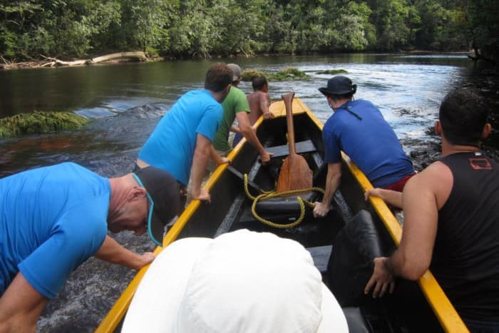 Dragging the canoe through a shallow spot in the river. Expect to do a fair bit of this during low water...