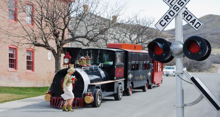 Ride a train around This is the Place Heritage Park and hop off when you want to try some authentic pioneer activities.