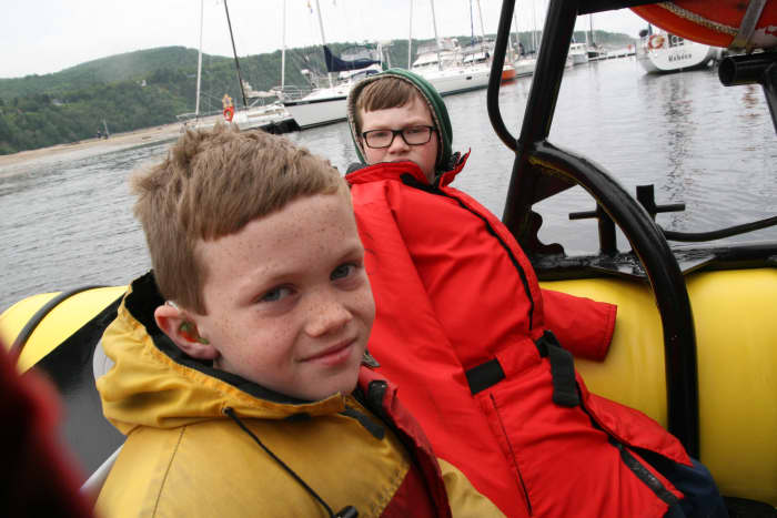 It is possible to get close to whales on a zodiac, outfitted with survival suits for the frigid waters of the St. Lawrence Seaway.