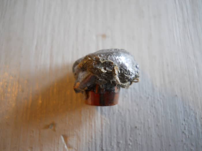 260 grain, .375 AccuBond recovered from green wood. Note perfect mushroom. Bullet held together at over 2600 fps impact velocity. and penetrated more than 11 inches. 90% weight retention.