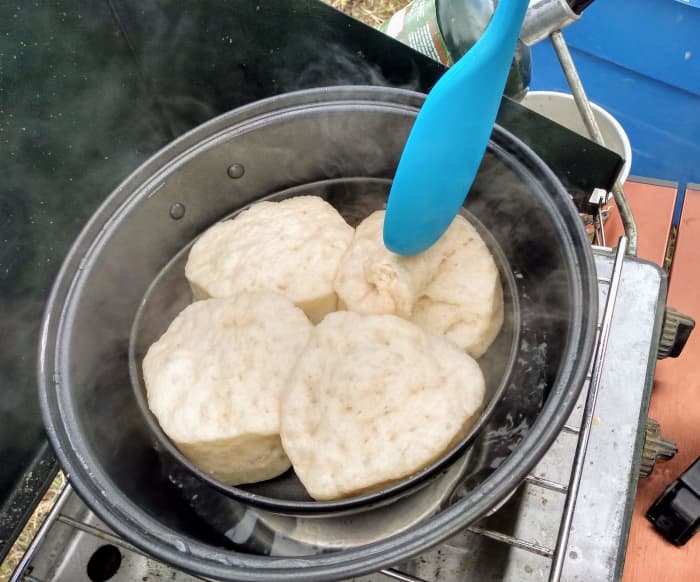 You can just see the upside down lid beneath the pan that the biscuits are in. Look at all that steam!